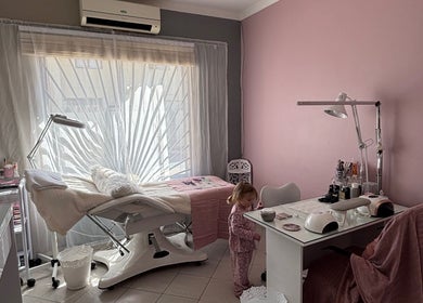 Tranquil treatment room at Ava Beauty in Windhoek, Khomas Region, NA with pink tones and cozy decor.
