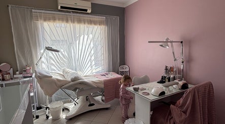 Tranquil treatment room at Ava Beauty in Windhoek, Khomas Region, NA with pink tones and cozy decor.