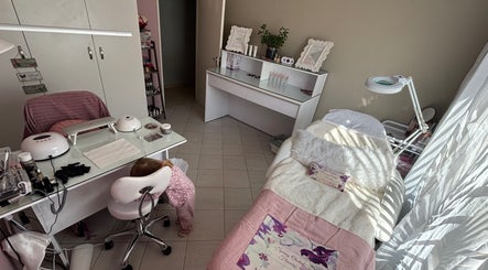 Cozy treatment room at Ava Beauty in Windhoek, Khomas Region, NA featuring a bed and modern equipment.