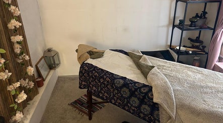 Relaxing massage room at Hands Of Nature Massage Therapy in Kineton, England, GB, featuring a cozy massage table.