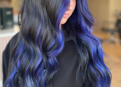 Woman with vibrant blue and black hair at JD’s beauty bar, Pontyclun, Wales, GB.