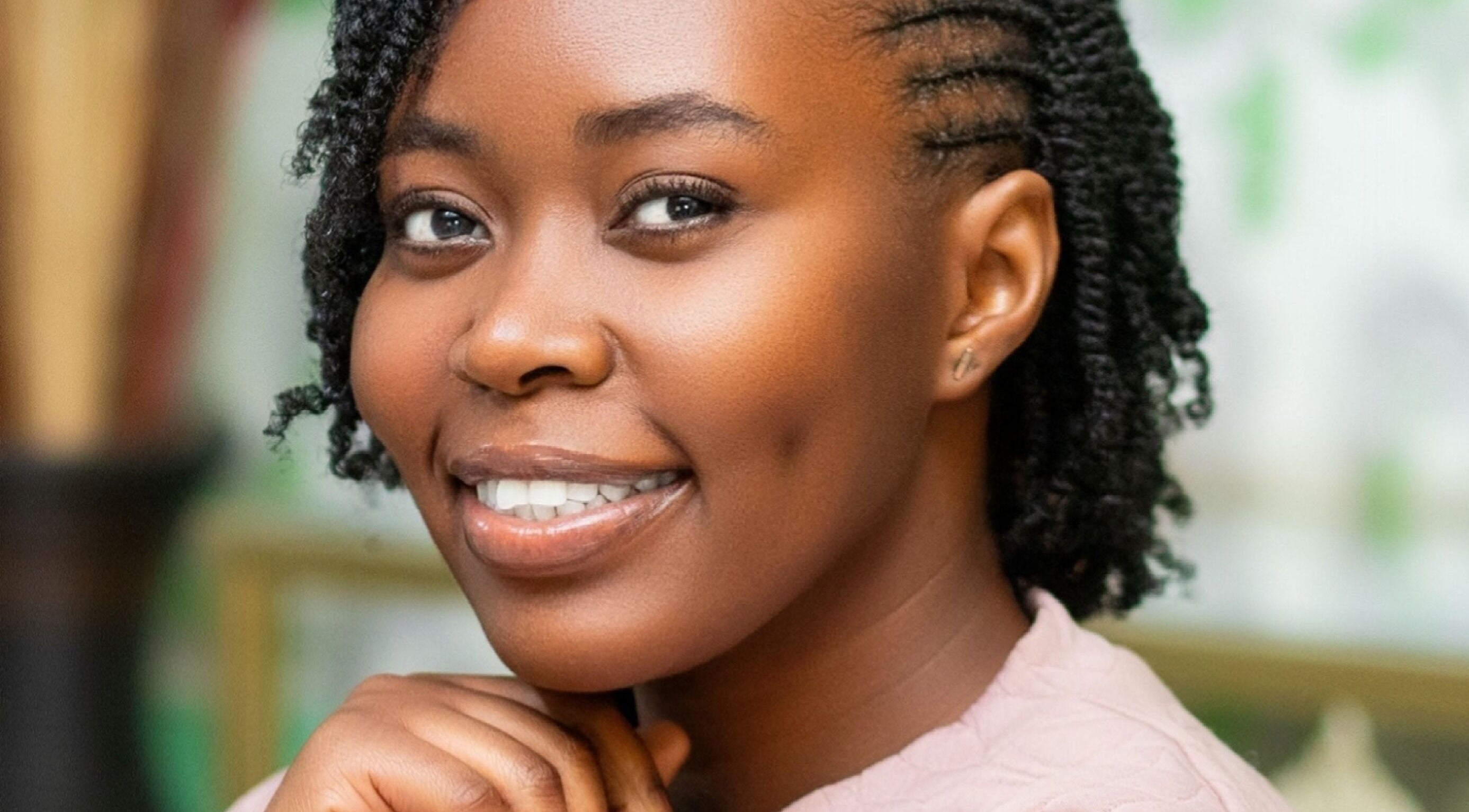 Woman smiling with styled hair at Natural Kurls Kabulonga Branch, Lusaka, Lusaka Province, ZM.