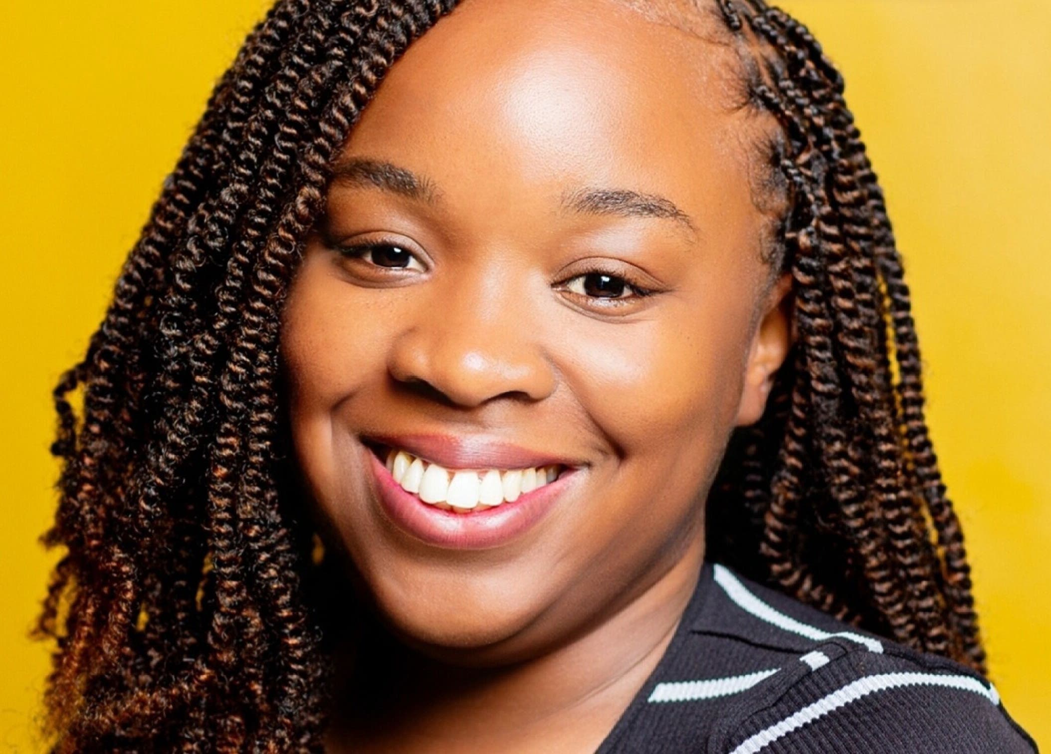 Smiling customer with styled hair at Natural Kurls Kitwe Branch, Kitwe, Copperbelt Province, ZM.