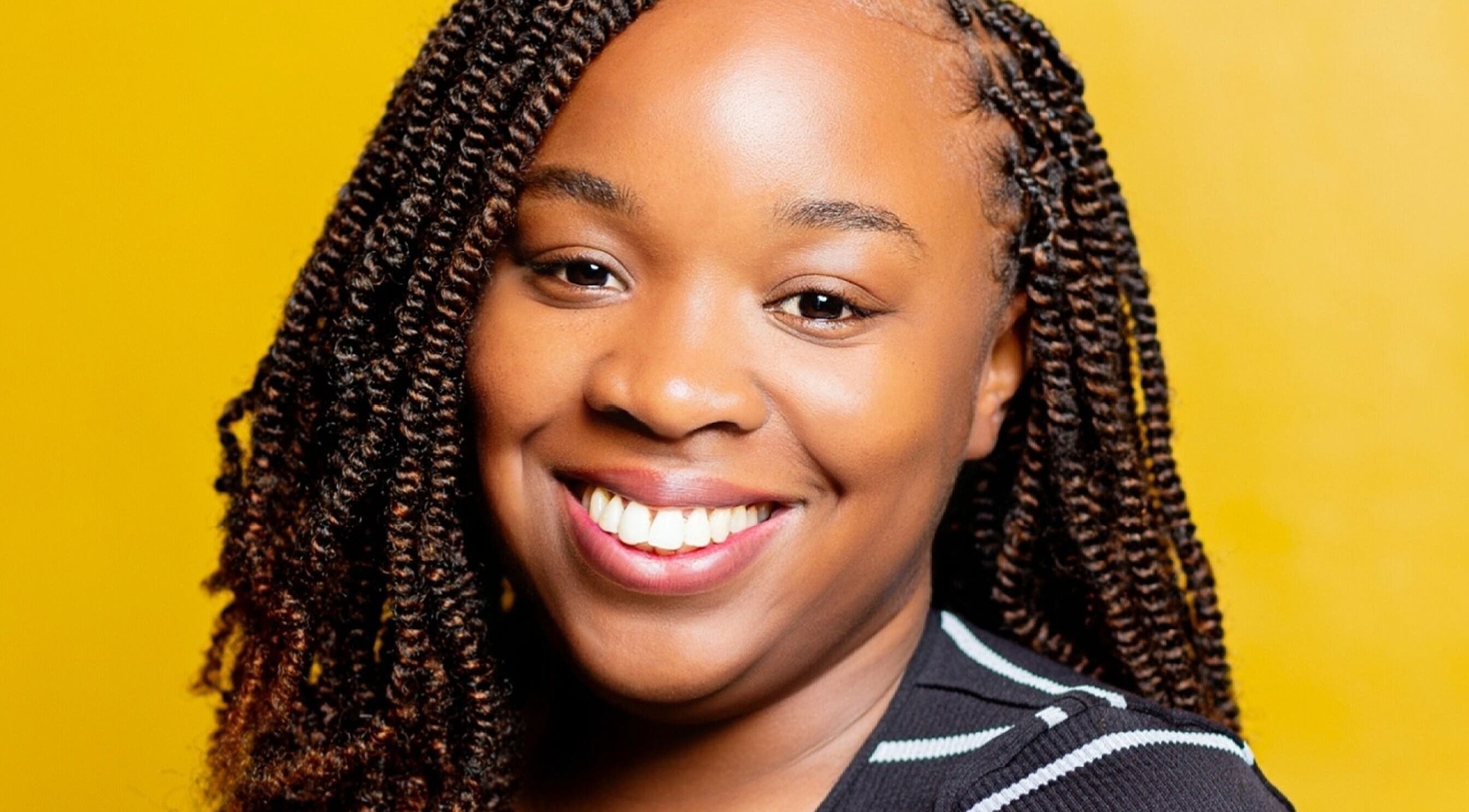 Smiling customer with styled hair at Natural Kurls Kitwe Branch, Kitwe, Copperbelt Province, ZM.