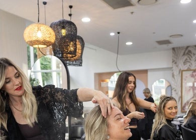 Stylists at Moosh Hair Studio in Tweed Heads, New South Wales, AU, providing hair treatments to clients.