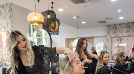 Stylists at Moosh Hair Studio in Tweed Heads, New South Wales, AU, providing hair treatments to clients.