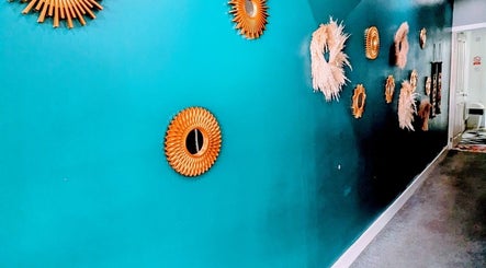 Golden floral wall decor at Orchid Thai massage beauty and spa in Kidsgrove, England, GB.