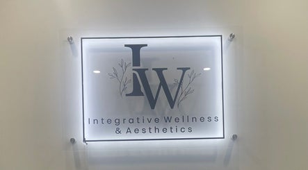 Illuminated sign of Integrative Wellness & Aesthetics in Laredo, Texas, US, showcasing sleek modern design.