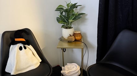 Integrative Wellness & Aesthetics cozy corner with decor and plant in Laredo, Texas, US.