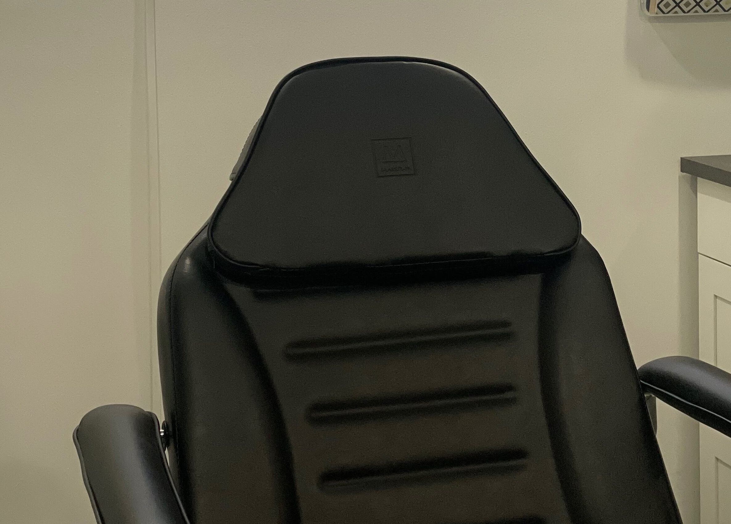 Elegant black treatment chair at Integrative Wellness & Aesthetics, Laredo, Texas, US.