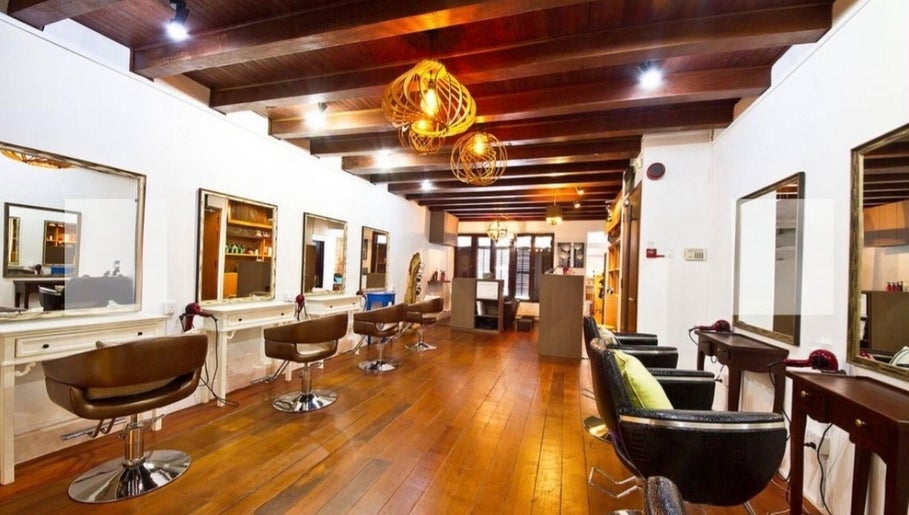 Interior of Su-a hair studio showcasing sleek styling chairs and mirrors, Singapore, Singapore, SG.