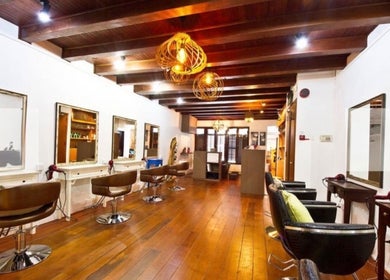 Interior of Su-a hair studio showcasing sleek styling chairs and mirrors, Singapore, Singapore, SG.