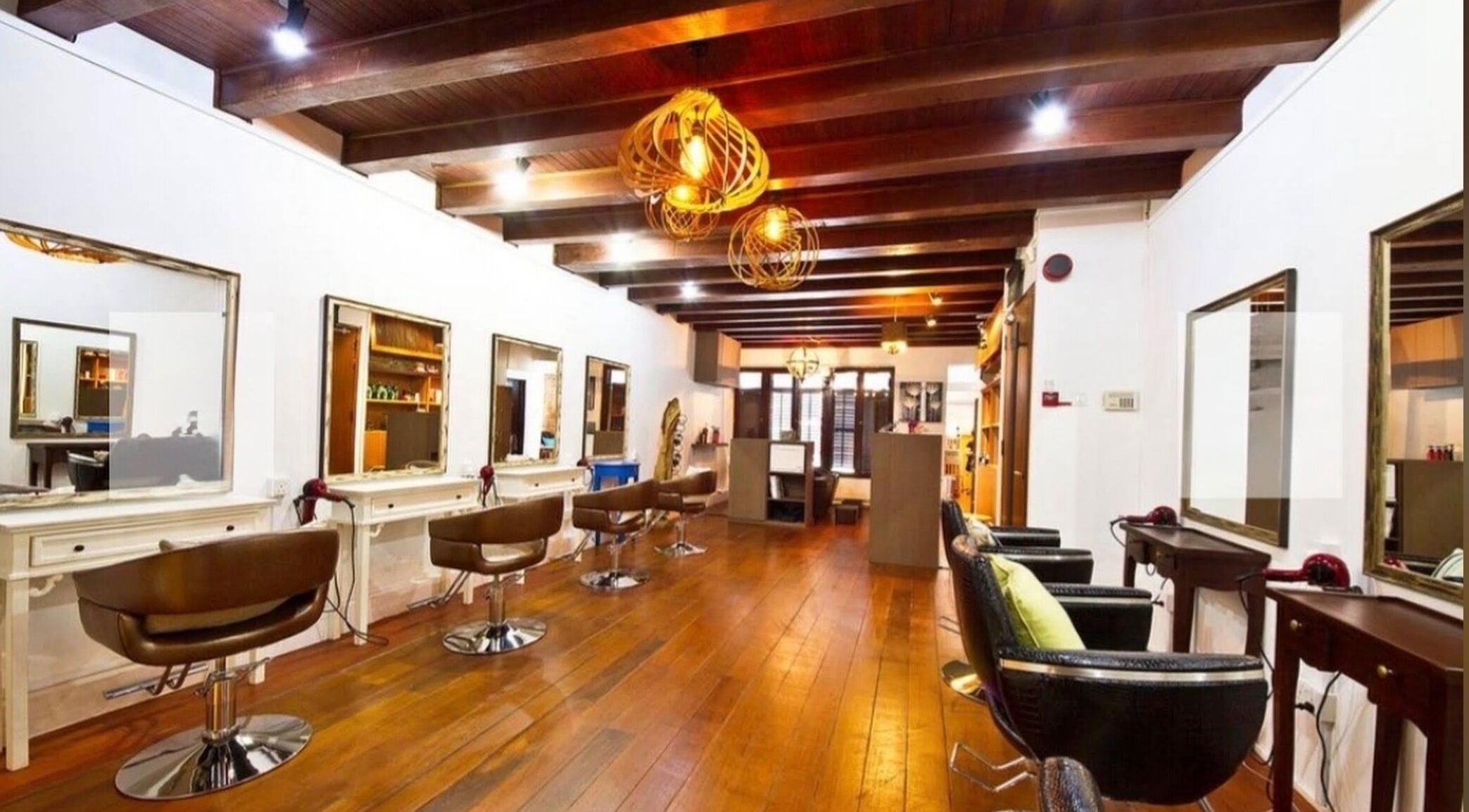 Interior of Su-a hair studio showcasing sleek styling chairs and mirrors, Singapore, Singapore, SG.
