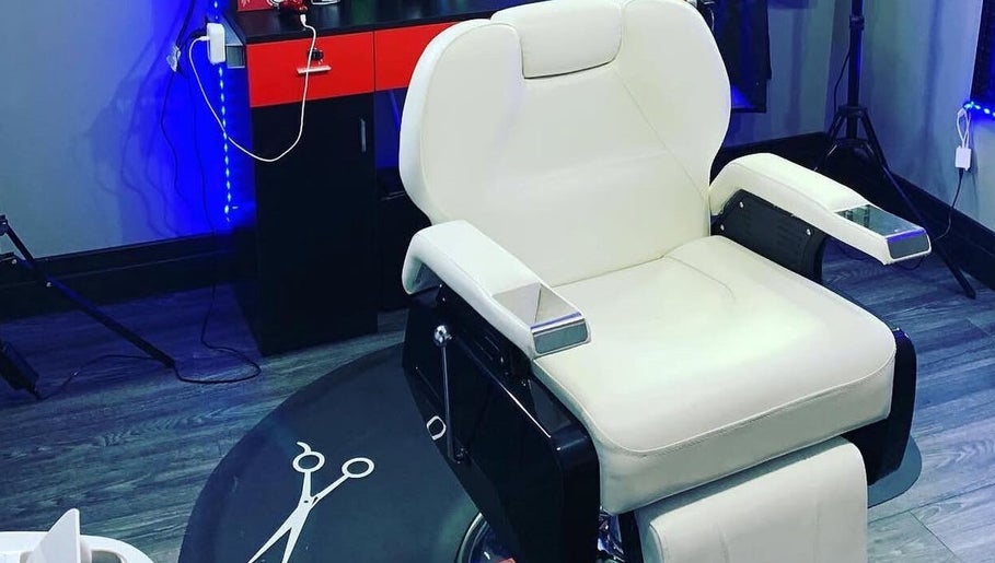 Modern barber chair at KutzByTmo in Dubai, Dubai, AE, ready for a stylish haircut.