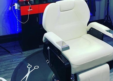Modern barber chair at KutzByTmo in Dubai, Dubai, AE, ready for a stylish haircut.