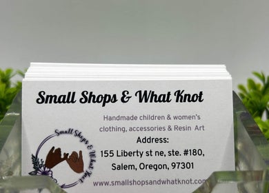 Stack of business cards at Gaby’s Glow Studio, Salem, Oregon, US, showcasing unique designs.