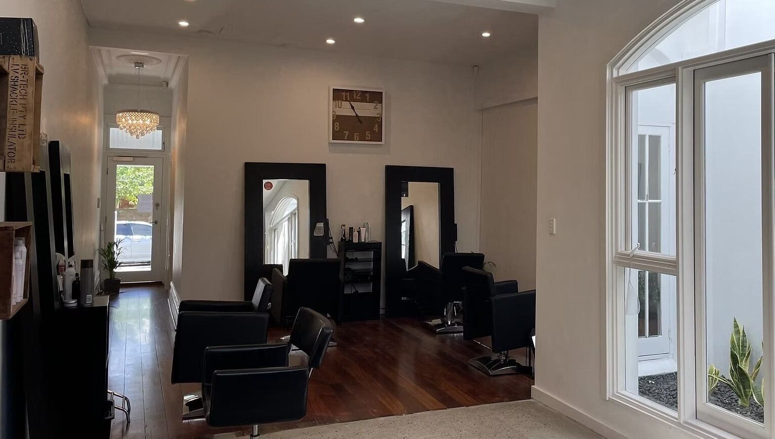 Chic interior of JLG - The Chemistry Of Great Hair in Subiaco, Western Australia, AU with stylish chairs and decor.