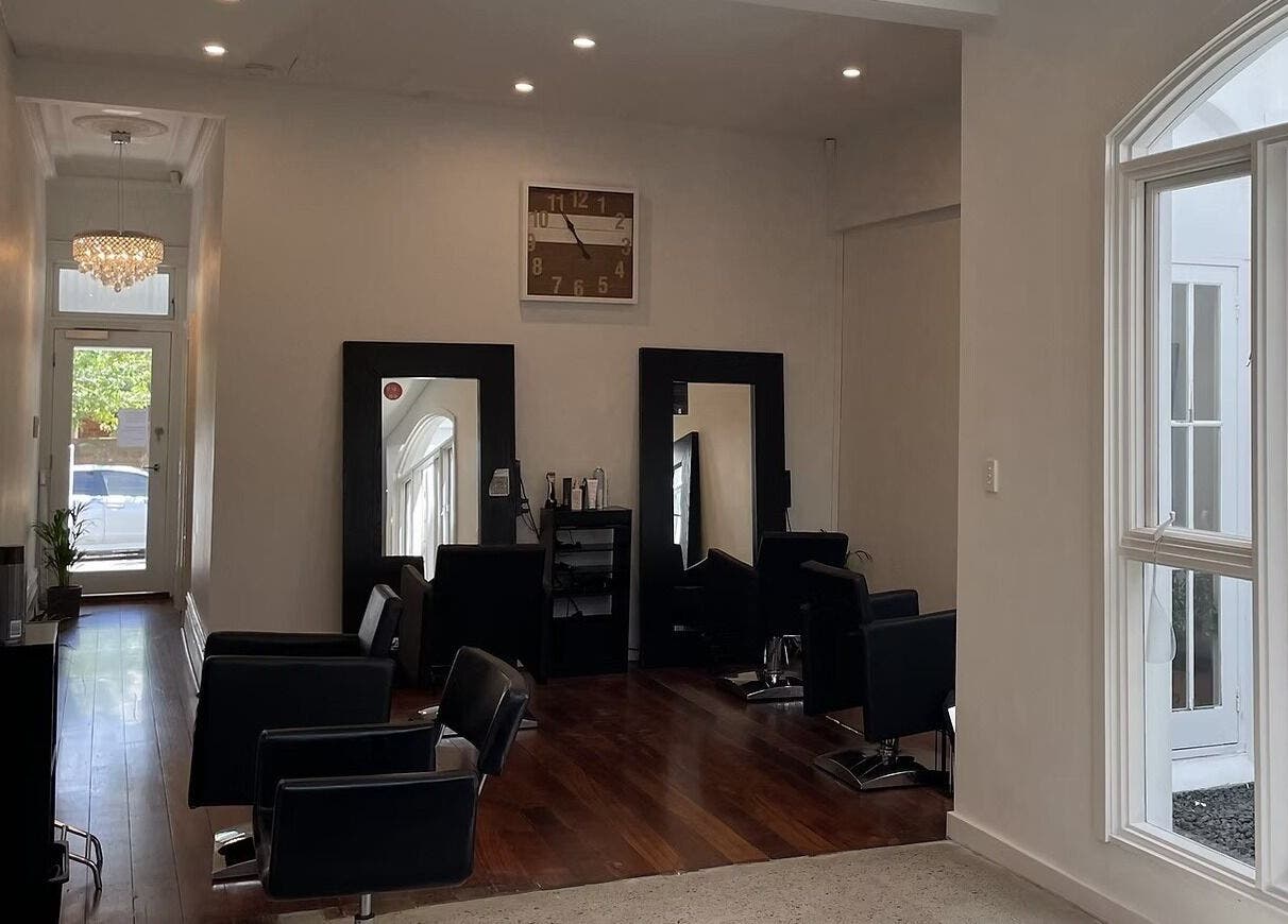 Chic interior of JLG - The Chemistry Of Great Hair in Subiaco, Western Australia, AU with stylish chairs and decor.