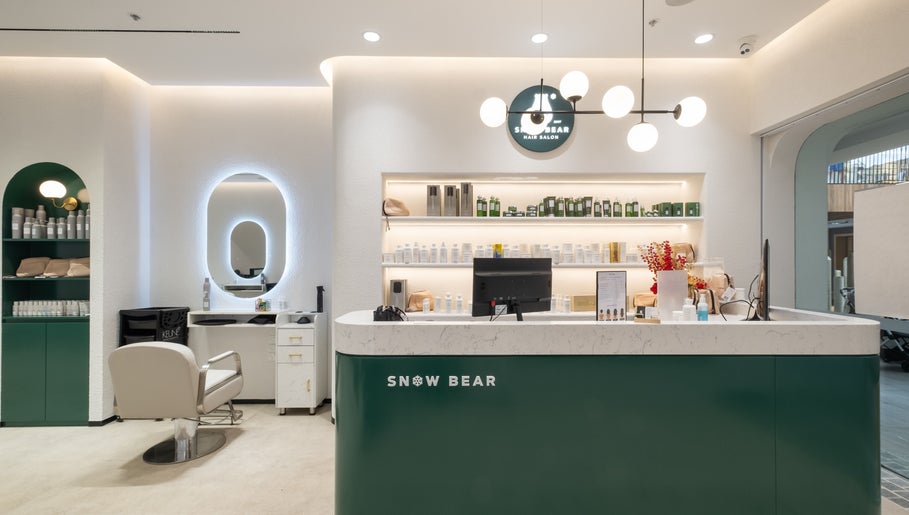 Reception area at Snow Bear Warringah Mall, Brookvale, New South Wales, AU showcasing sleek design and beauty products.