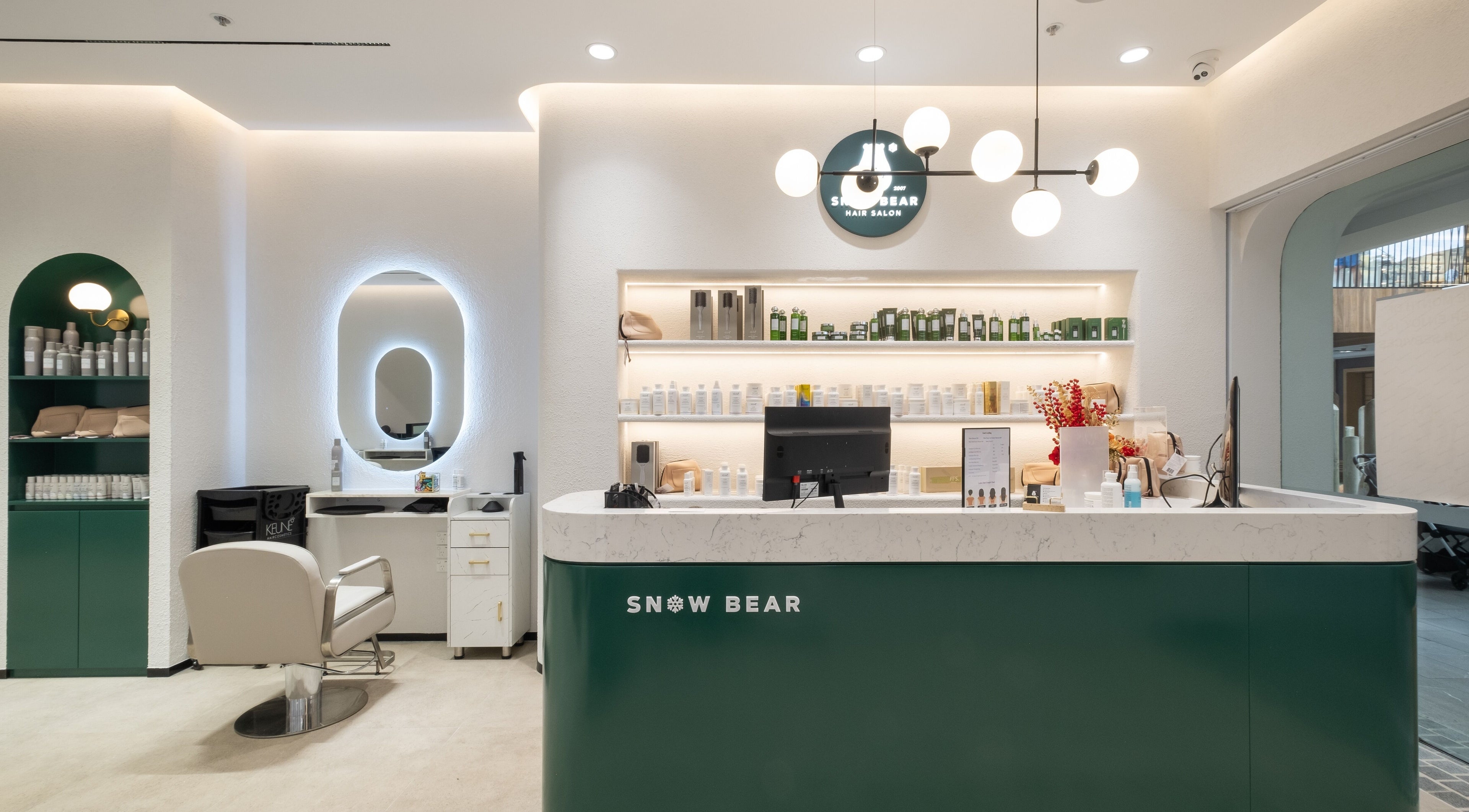 Reception area at Snow Bear Warringah Mall, Brookvale, New South Wales, AU showcasing sleek design and beauty products.