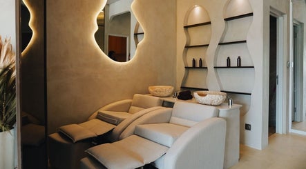 Luxury wellness room at Solve Sana in Bali, Bali, ID with cozy massage chairs and ambient lighting.