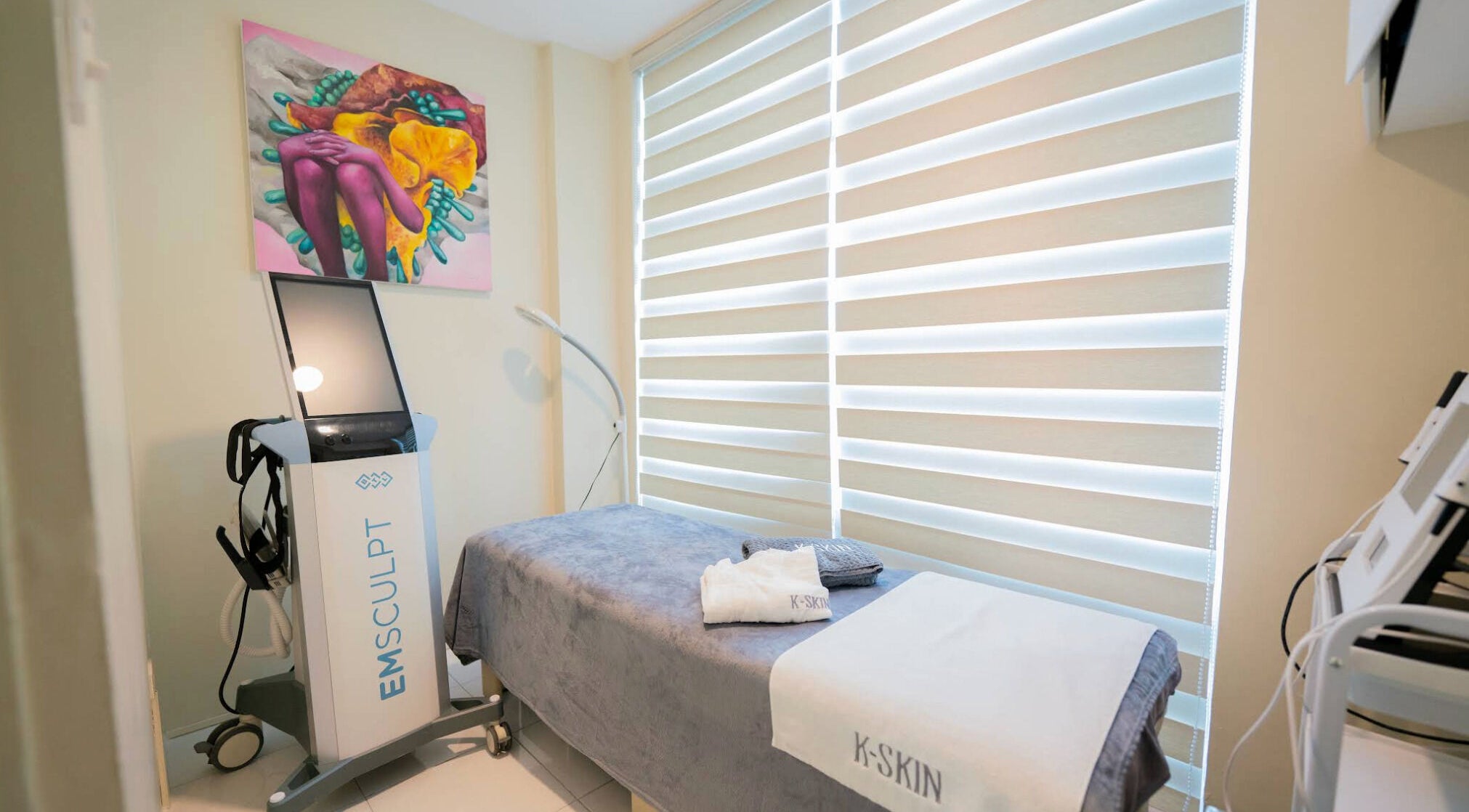 Relaxing spa room at K-Skin Wellness, Quezon City, Metro Manila, PH with a comfortable treatment bed and equipment.