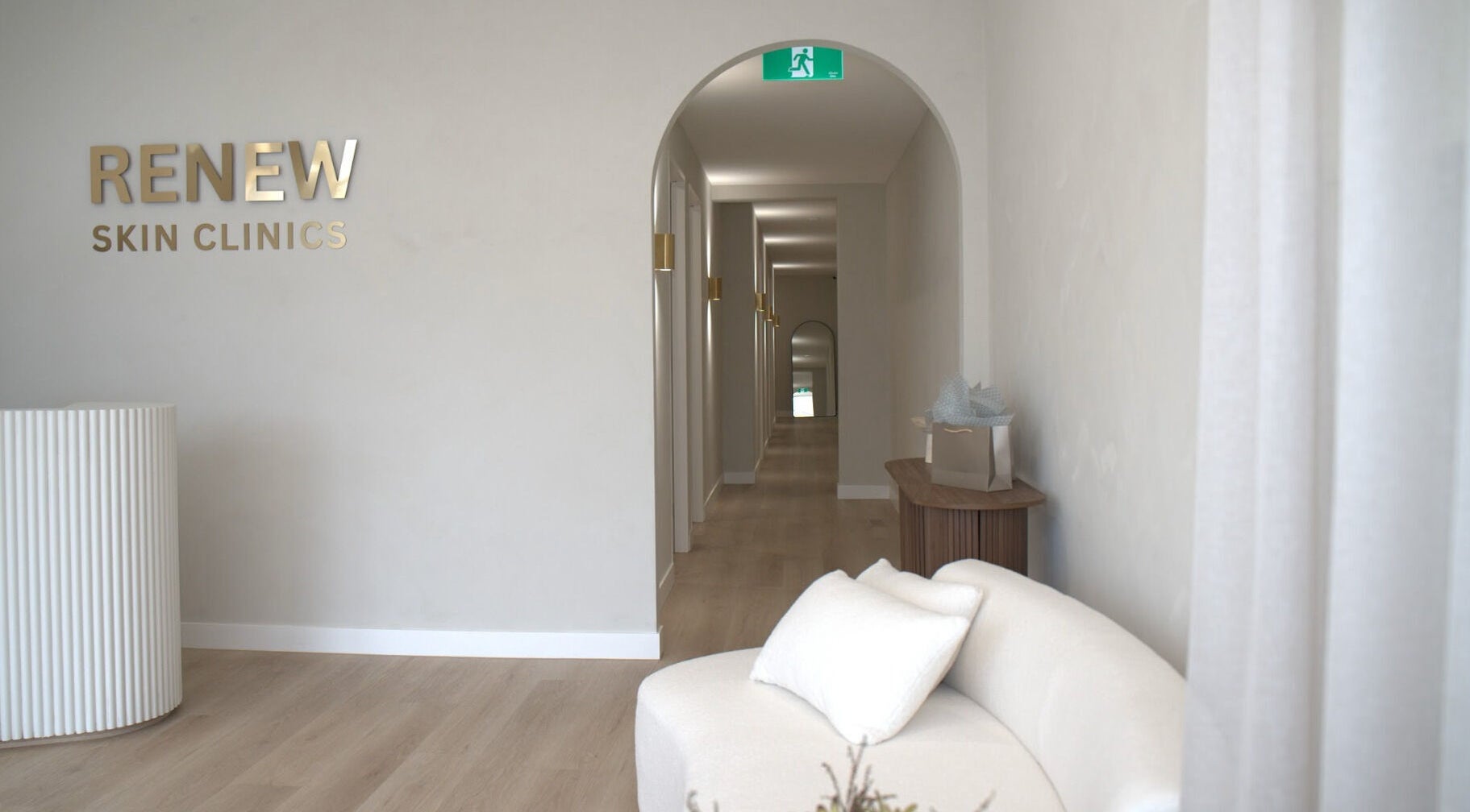 Modern interior of Renew Skin Clinics, Melbourne, Victoria, AU, featuring a stylish hallway with soft seating.