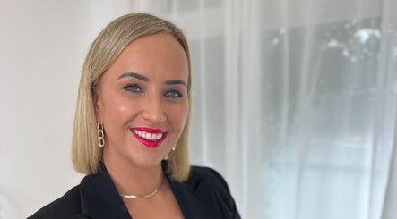 Smiling professional at 📍NEW LOCATION - The Glow Up Clinic, Melbourne, Victoria, AU.