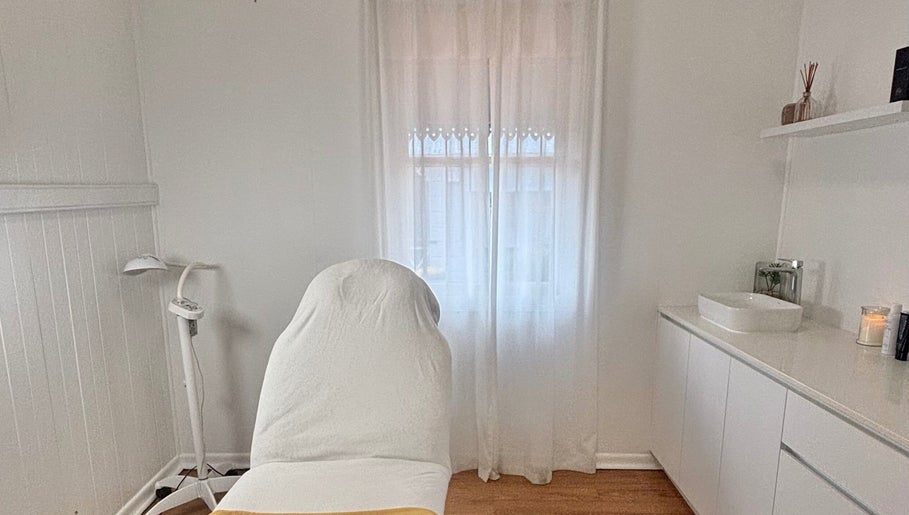 Tranquil treatment room at The Glow Up Clinic, Kangaroo Point, Queensland, AU with massage table and calm decor.