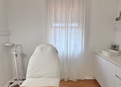Tranquil treatment room at The Glow Up Clinic, Kangaroo Point, Queensland, AU with massage table and calm decor.