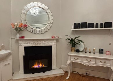 Elegant room at The GLOW UP Clinic (Elsternwick), featuring a mirror, sink, and decor in Melbourne, Victoria, AU.