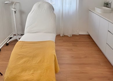 Calming treatment room at The GLOW UP Clinic (Brisbane), Kangaroo Point, Queensland, AU, with cozy decor.