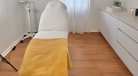Calming treatment room at The GLOW UP Clinic (Brisbane), Kangaroo Point, Queensland, AU, with cozy decor.