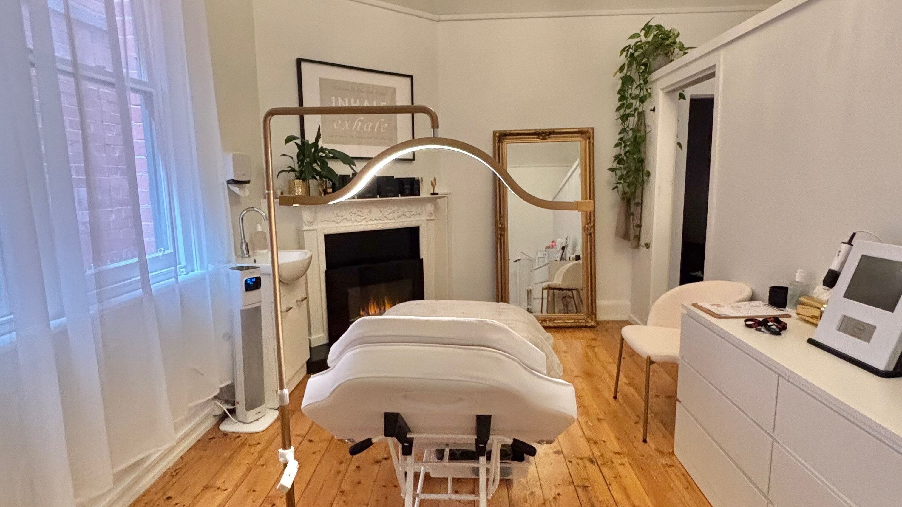 Tranquil treatment room at The GLOW UP Clinic (Elsternwick), Melbourne, Victoria, AU, with elegant decor.