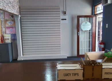 Reception of Lucy Hairstylist @ Cape & Scissors, Mossel Bay, Western Cape, ZA with stylish decor and entry door.