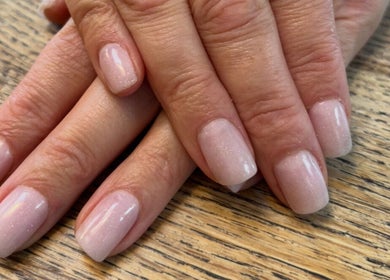 Elegant nude nails manicure at Leigh & Rose, Flitwick, England, GB, showcasing sophisticated nail art.