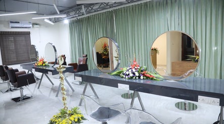 Sophisticated salon interior at Shaakya Spa & Wellness, Bengaluru, Karnataka, IN, showcasing styling stations.