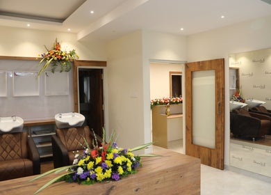 Elegant interior at Shaakya Spa & Wellness, Bengaluru, Karnataka, IN with luxurious seating and vibrant floral décor.