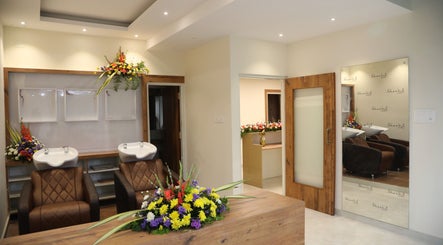 Elegant interior at Shaakya Spa & Wellness, Bengaluru, Karnataka, IN with luxurious seating and vibrant floral décor.