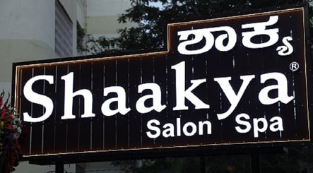 Shaakya Spa & Salon entrance sign in Bengaluru, Karnataka, IN illuminated at night.