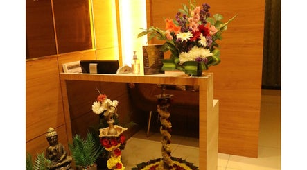 Reception area at Shaakya Spa & Wellness, Bengaluru, Karnataka, IN with flowers and decor.