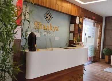Reception area of Shaakya Spa & Wellness, Bengaluru, Karnataka, IN with plants and modern decor.