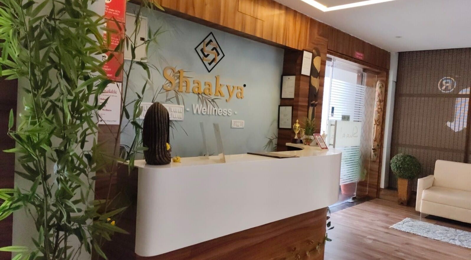 Reception area of Shaakya Spa & Wellness, Bengaluru, Karnataka, IN with plants and modern decor.