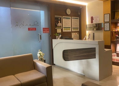 Reception area at Shaakya Spa & Salon, Bengaluru, Karnataka, IN, featuring a cozy seating area and elegant decor.