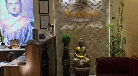 Elegant reception area at Shaakya Spa & Salon in Bengaluru, Karnataka, IN featuring serene decor and artwork.