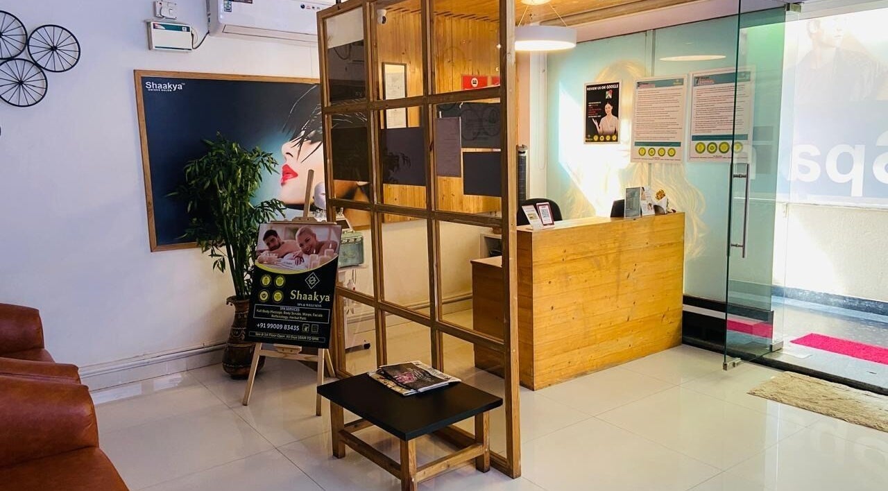 Reception area of Shaakya Spa & Salon featuring wooden decor in Bengaluru, Karnataka, IN.