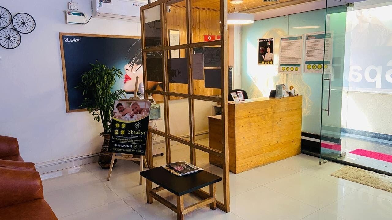 Reception area of Shaakya Spa & Salon featuring wooden decor in Bengaluru, Karnataka, IN.