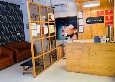 Reception area of Shaakya Spa & Salon, Bengaluru, Karnataka, IN. Stylish design with leather sofas and modern decor.
