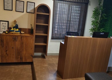 Reception area at Shaakya Spa & Wellness in Bengaluru, Karnataka, IN with a serene decor and Buddha statue.