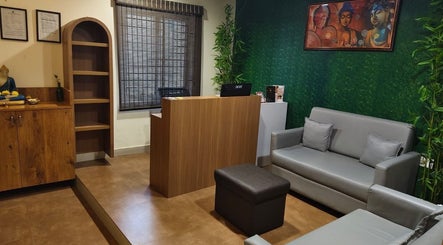 Reception at Shaakya Spa & Wellness in Bengaluru, Karnataka, IN. Cozy ambiance with modern decor and Buddha art.
